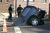 Sinkhole Swallows SUV. Driver Treated for 'Shock'-nysf10103271856_sp.jpeg